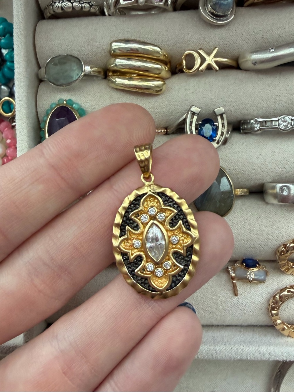 Gold tone and blackened gold pendant